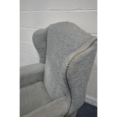 1262 - A WING BACK ARMCHAIR, with scrolled armrests, on front cabriole legs, width 82cm x depth 85cm x heig... 