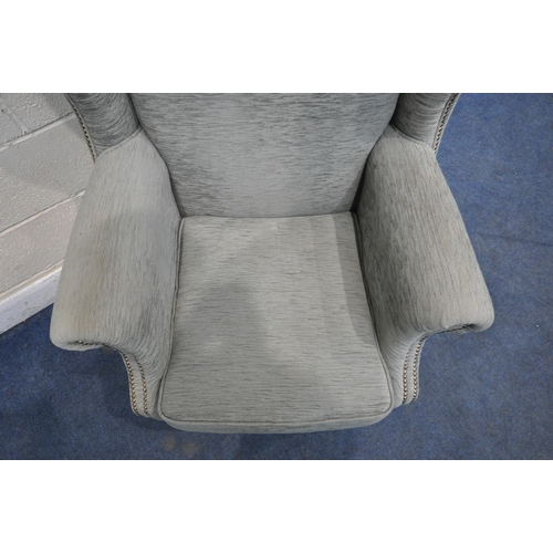 1262 - A WING BACK ARMCHAIR, with scrolled armrests, on front cabriole legs, width 82cm x depth 85cm x heig... 