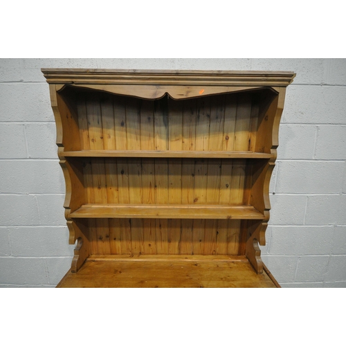 1269 - A 19TH CENTURY PINE DRESSER, the top two tier plate rack, on a base with a single cupboard door and ... 