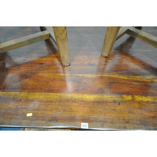 1277 - A HARDWOOD RECTANGULAR REFECTORY TABLE, on block and turned supports, united by a H stretcher, lengt... 