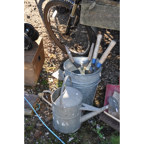 1009 - A VINTAGE GALVANISED WATERING CAN four modern galvanised buckets and a selection of garden tools (15... 