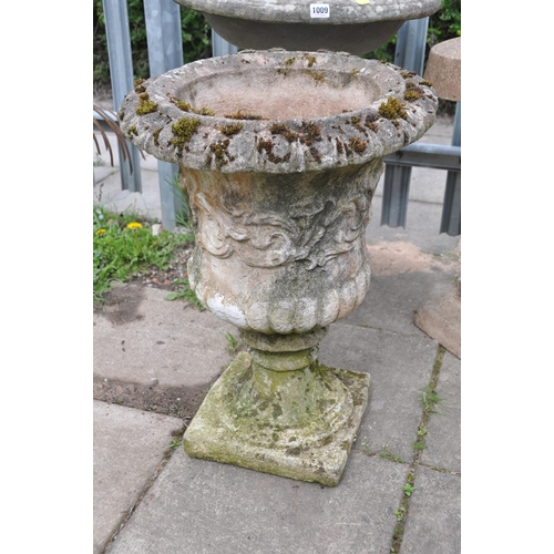 1013 - A WEATHERED COMPOSITE CAMPAGNA GARDEN URN measuring diameter 44cm x height 63cm, along with a concre... 