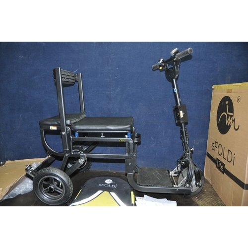 1079 - AN eFOLDI LITE FOLDING MOBILITY SCOOTER in original packaging with battery, charger and back pack (P... 