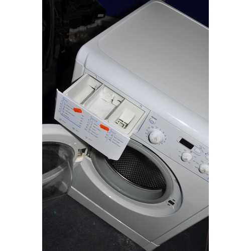 1082 - AN INDESIT IWD7415 WASHING MACHINE width 60cm depth 55cm height 85cm(PAT pass, powers up, spin cycle... 