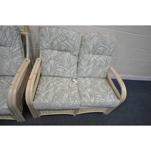 1305 - A RATTAN THREE PIECE CONSERVATORY SUITE, comprising a two seater sofa, length 122cm x depth 88cm x h... 