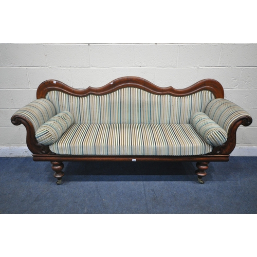 1306 - A VICTORIAN WALNUT THREE SEATER SOFA, with a shaped back, scrolled armrests, on turned legs and late... 