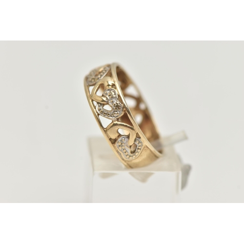 3 - A 9CT GOLD BAND RING, open work wide band, detailed with hearts set with single cut diamond accents,... 