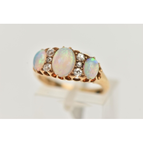 39 - AN EARLY 20TH CENTURY OPAL AND DIAMOND RING, three oval cabochon opals prong set in yellow metal, in... 