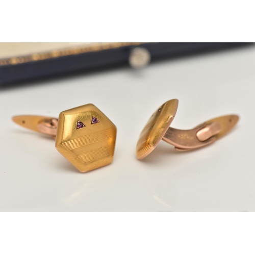 44 - A PAIR OF YELLOW METAL GEM SET CUFFLINKS, hexagon form cufflinks, with engine turned pattern, two ci... 