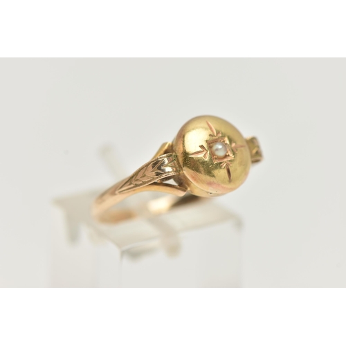 5 - A YELLOW METAL RING, possible conversion piece, domed ring set with a small seed pearl, scroll detai... 