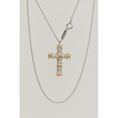 50 - A 'TIFFANY & CO' 'SCHLUMBERGER' DIAMOND CROSS PENDANT, ten round brilliant cut diamonds prong set in... 