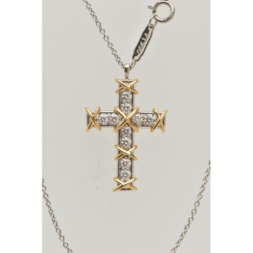 50 - A 'TIFFANY & CO' 'SCHLUMBERGER' DIAMOND CROSS PENDANT, ten round brilliant cut diamonds prong set in... 