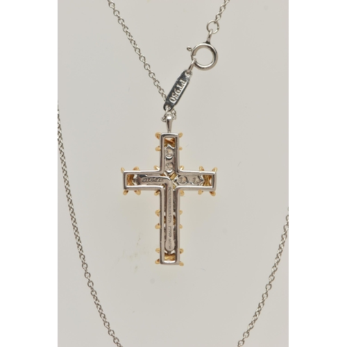 50 - A 'TIFFANY & CO' 'SCHLUMBERGER' DIAMOND CROSS PENDANT, ten round brilliant cut diamonds prong set in... 