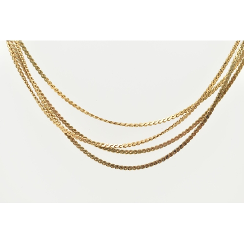 55 - A YELLOW METAL NECKLACE, comprised of four s link chains, fitted together with a push pin box clasp ... 