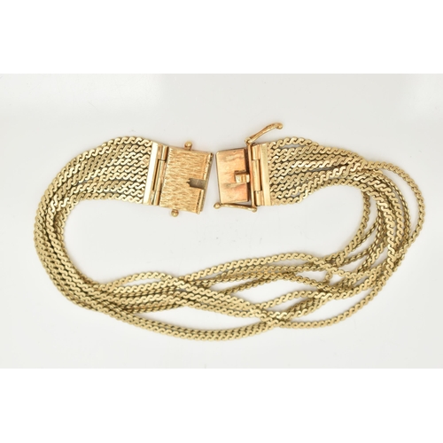 56 - A YELLOW METAL BRACELET, comprised of nine s link chains, fitted together with a push pin box clasp ... 