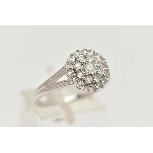 6 - A WHTE METAL DIAMOND CLUSTER RING, circular cluster set with round brilliant and single cut diamonds... 