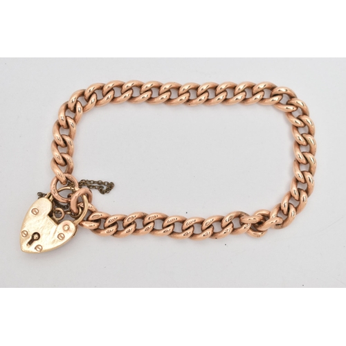 66 - A 9CT GOLD CURB LINK BRACELET, solid links, each linked stamped 9.375, fitted with a heart padlock c... 