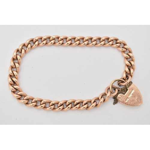 66 - A 9CT GOLD CURB LINK BRACELET, solid links, each linked stamped 9.375, fitted with a heart padlock c... 