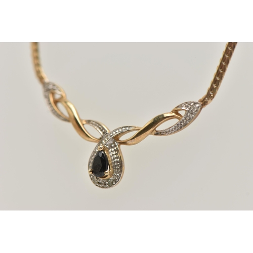 9 - A 9CT GOLD SAPPHIRE AND DIAMOND PENDANT NECKLACE, pendant set with a pear cut deep blue sapphire, si... 