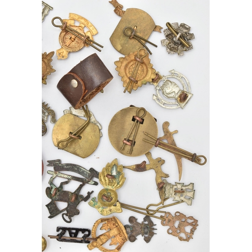 103 - AN ASSORTMENT OF CAP BADGES, a selection of cap badges and pins from various military regiments