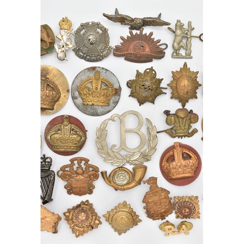 103 - AN ASSORTMENT OF CAP BADGES, a selection of cap badges and pins from various military regiments