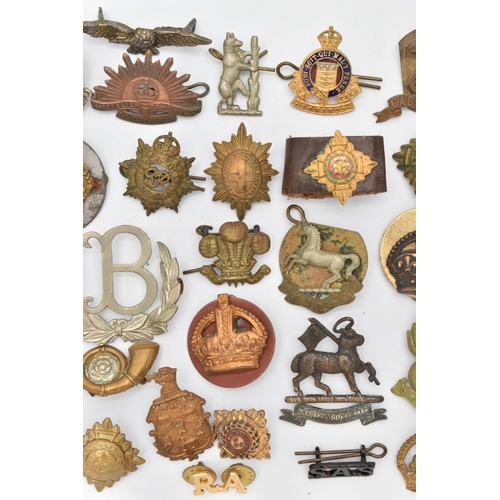 103 - AN ASSORTMENT OF CAP BADGES, a selection of cap badges and pins from various military regiments