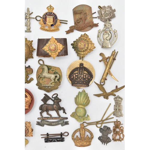 103 - AN ASSORTMENT OF CAP BADGES, a selection of cap badges and pins from various military regiments