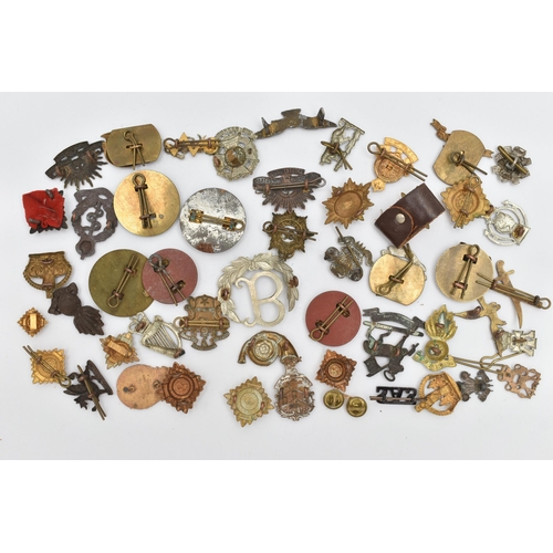 103 - AN ASSORTMENT OF CAP BADGES, a selection of cap badges and pins from various military regiments