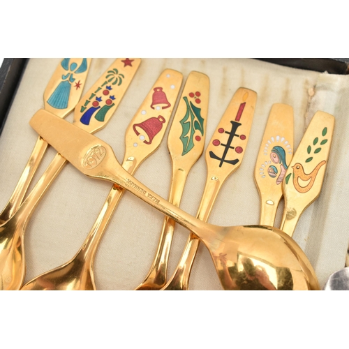 115 - TWO SETS OF DANISH SPOONS, to include a set of eight yellow metal teaspoons, decorated with a Christ... 