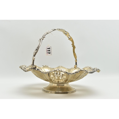 117 - A WHITE METAL CAKE BASKET DISH, the dish with openwork foliate detail within a floral and scrolling ... 