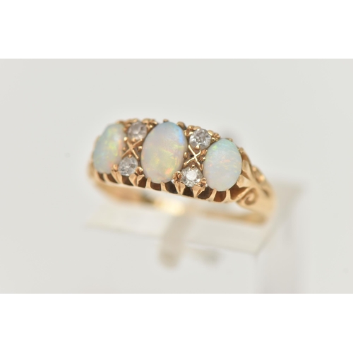 75 - AN EARLY 20TH CENTURY, 18CT GOLD OPAL AND DIAMOND RING, designed with three oval opal cabochons, int... 