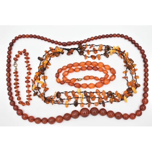 83 - AMBER BEAD NECKLACES AND PLASTIC BEAD NECKLACES, to include an amber bead necklace knotted on a blac... 