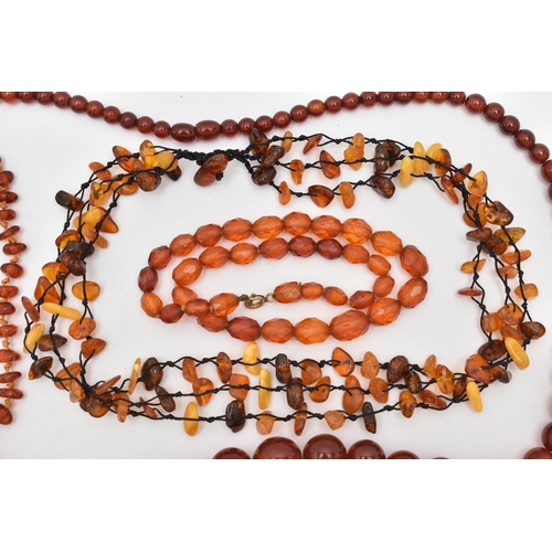 83 - AMBER BEAD NECKLACES AND PLASTIC BEAD NECKLACES, to include an amber bead necklace knotted on a blac... 