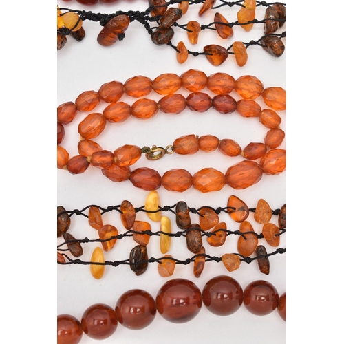 83 - AMBER BEAD NECKLACES AND PLASTIC BEAD NECKLACES, to include an amber bead necklace knotted on a blac... 