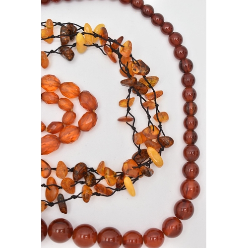 83 - AMBER BEAD NECKLACES AND PLASTIC BEAD NECKLACES, to include an amber bead necklace knotted on a blac... 