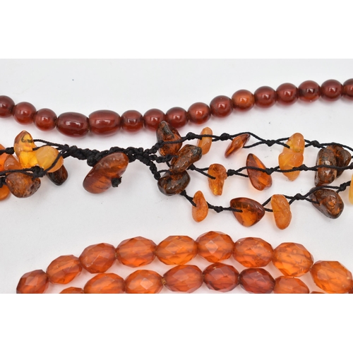 83 - AMBER BEAD NECKLACES AND PLASTIC BEAD NECKLACES, to include an amber bead necklace knotted on a blac... 