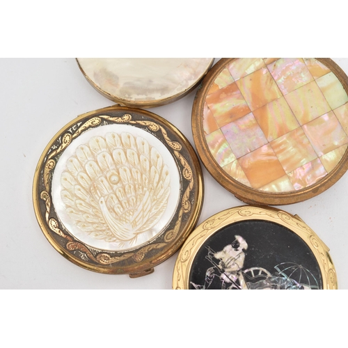 95 - FOUR COMPACTS, to include a circular compact with a carved mother of pearl peacock, a mother of pear... 