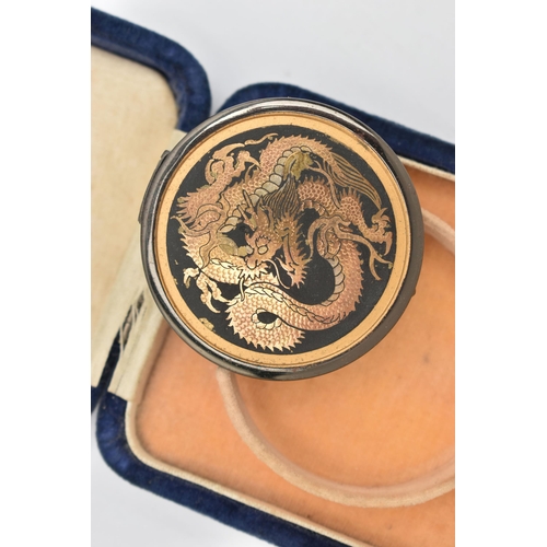 96 - A BOXED 'DAMASCENE' COMPACT, of circular form featuring an oriental dragon, boxed signed inside 'Gua... 