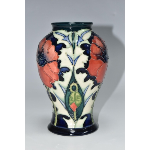 306 - A MOORCROFT POTTERY BALUSTER VASE DECORATED WITH POPPIES ON A PALE GREEN AND DARK BLUE GROUND, circa... 