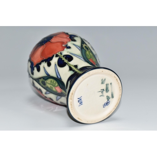 306 - A MOORCROFT POTTERY BALUSTER VASE DECORATED WITH POPPIES ON A PALE GREEN AND DARK BLUE GROUND, circa... 