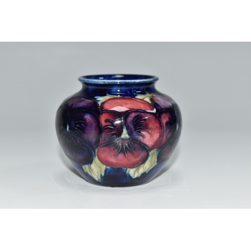 308 - A MOORCROFT POTTERY 'BLUE PANSY' PATTERN SMALL BULBOUS VASE, purple and blue pansies on a dark blue ... 