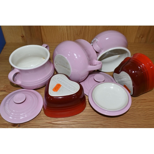 312 - A GROUP OF LE CREUSET, comprising three pale pink stoneware individual casserole dishes with covers,... 