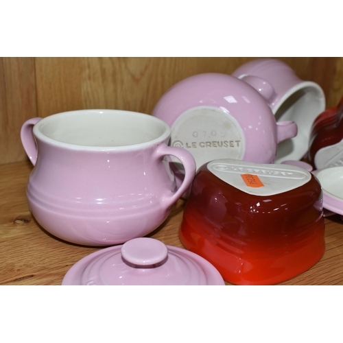 312 - A GROUP OF LE CREUSET, comprising three pale pink stoneware individual casserole dishes with covers,... 