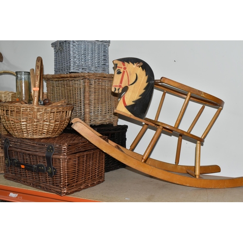 315 - A QUANTITY OF WICKER BASKETS, HAMPERS, CHAIR AND A WOODEN ROCKING HORSE, comprising a child's small ... 