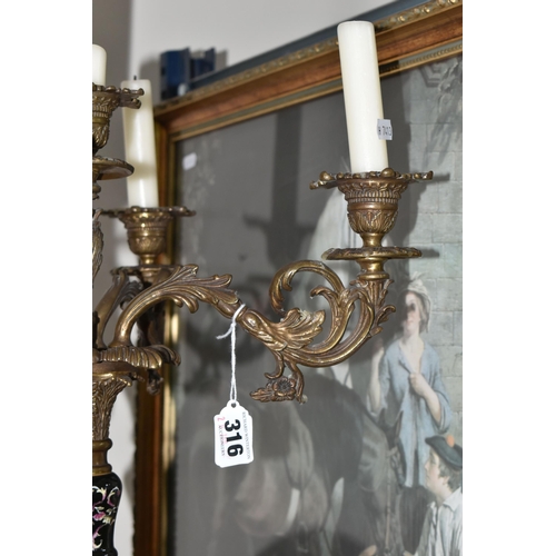 316 - A LARGE CANDELABRA AND TWO FRAMED PICTURES, comprising a Wong Lee porcelain and cast metal five flam... 