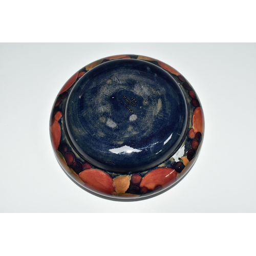 322 - A MOORCROFT POTTERY POMEGRANATE BOWL, decorated with pomegranates on a mottled blue ground, impresse... 