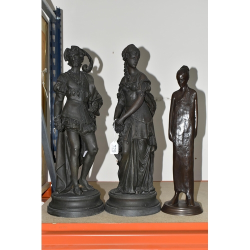 329 - THREE BRONZED FIGURINES, comprising a pair of spelter figurines of a young man and woman (possibly R... 