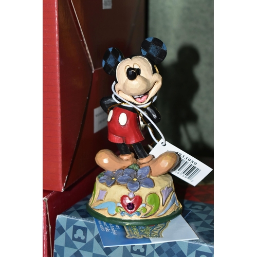 355 - THREE BOXED ENESCO DISNEY SHOWCASE FIGURES, from Disney Traditions by Jim Shore, comprising Easter A... 