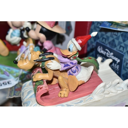 355 - THREE BOXED ENESCO DISNEY SHOWCASE FIGURES, from Disney Traditions by Jim Shore, comprising Easter A... 