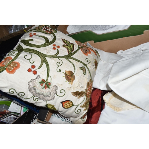 385 - TWO BOXES OF TABLE LINEN AND CUSHIONS, to include two hand embroidered cushions, a patchwork cushion... 